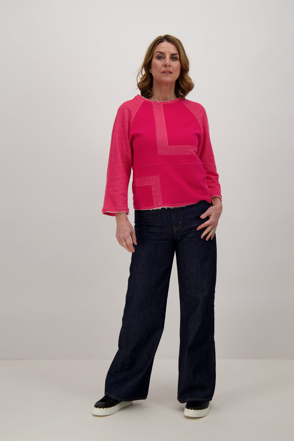 Model-Wearing-Pink-Magenta-Jersey-Top-Three-Quarter-Sleeve-front